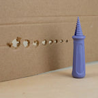 Optional purple hole-punch accessory making starter holes; sold separately