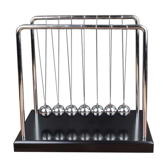 Newton's cradle desk display for a manually started moving accent on an office desk — Gearfinch