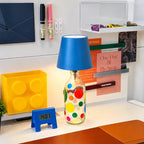Tête de lampe BottleGlow bleue sur une bouteille décorative tachetée