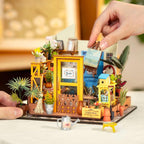 Illuminated greenhouse garden DIY kit arranged as a compact miniature scene for a shelf or desk