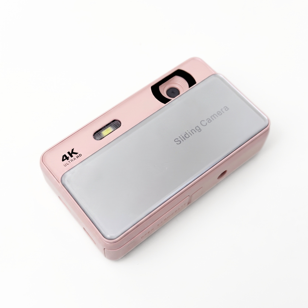 Roze Chroma Slide digitale camera met de schuiflensafdekking open