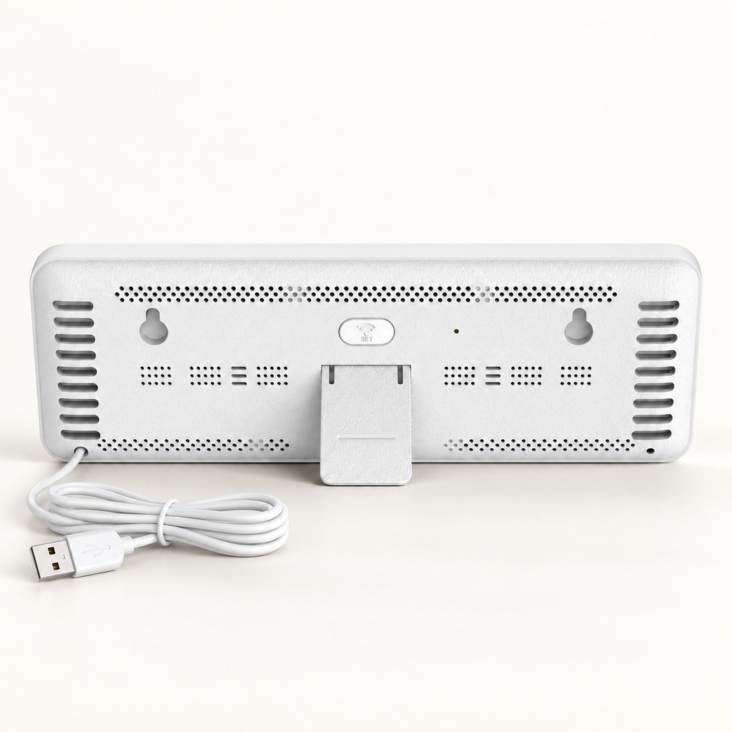 White F900 clock rear, folding stand, mounting slots and attached USB-A cable