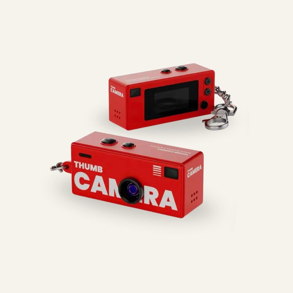 Red G6 keychain digital camera shown from the front and rear