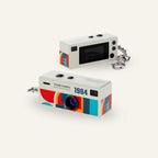 White G6 keychain digital camera shown from the front and rear