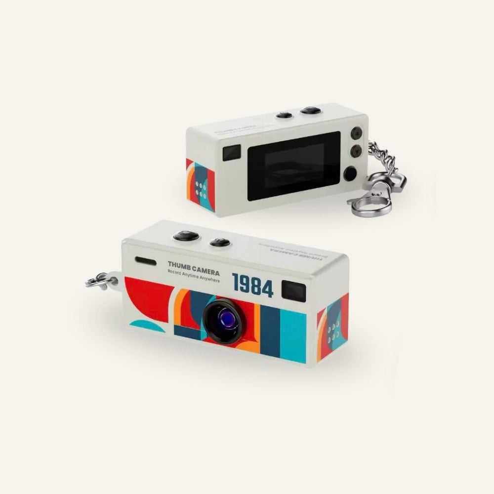 White G6 keychain digital camera shown from the front and rear — Gearfinch