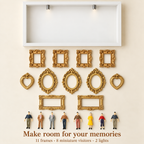 White shadow box, eleven miniature frames, eight visitors and two display lights