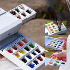 Close-up of the Field Studio palette drawers and removable pans filled with paint for demonstration
