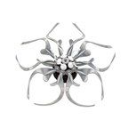 Metal flower sculpture with flowing stainless steel petals and a gear center, unusual anniversary keepsake