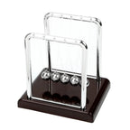 Compact Newton's cradle desk display for shoppers comparing the 9 × 7.5 × 9.5 cm option