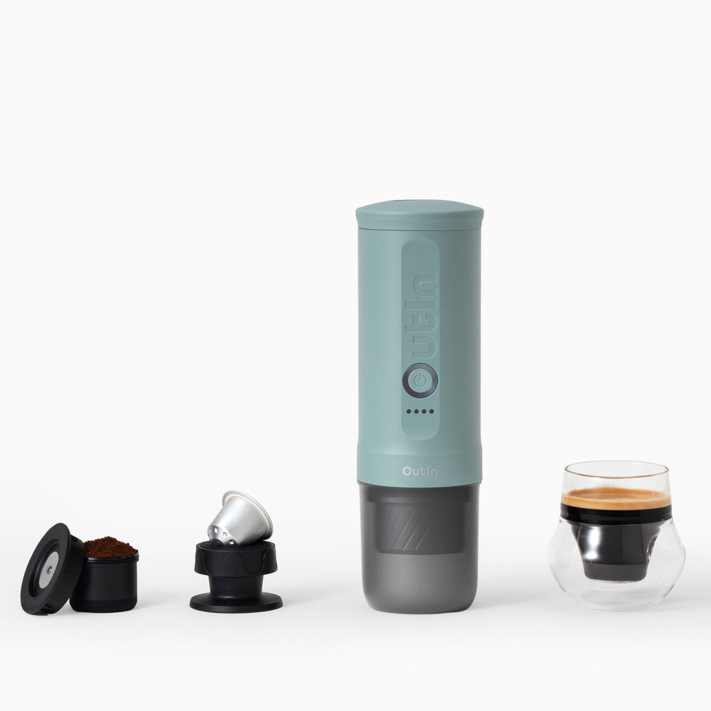 Canyon Green OutIn Nano 2 portable espresso machine beside coffee adapters and an espresso — Gearfinch