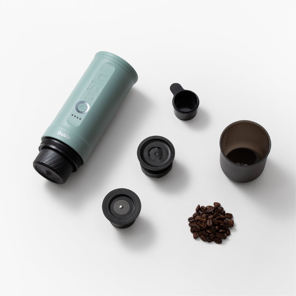 OutIn Nano 2 with coffee cup, scoop and brewing adapters laid out separately