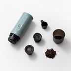 OutIn Nano 2 with coffee cup, scoop and brewing adapters laid out separately