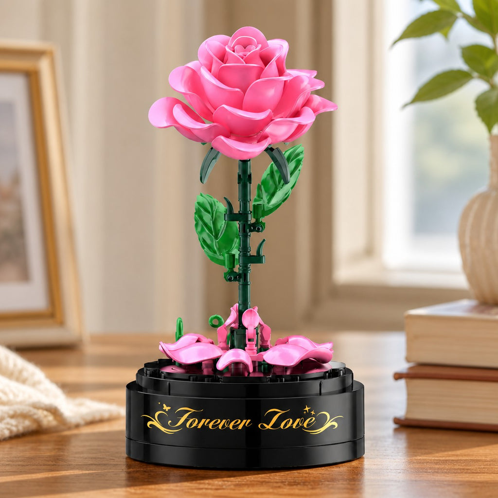 Rosa Rosen-Bauset ohne Haube mit sichtbaren Blütenblättern, Blättern und Spieluhrsockel