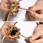 Gold wing Golden Snitch ring box with magnetic winged design that opens to reveal a velvet insert