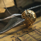 Gold wing Golden Snitch engagement ring box with a removable interior for a planned proposal reveal