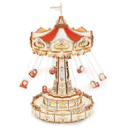 Enchanted carousel music box with red and white flying chairs beneath a classic retro roof