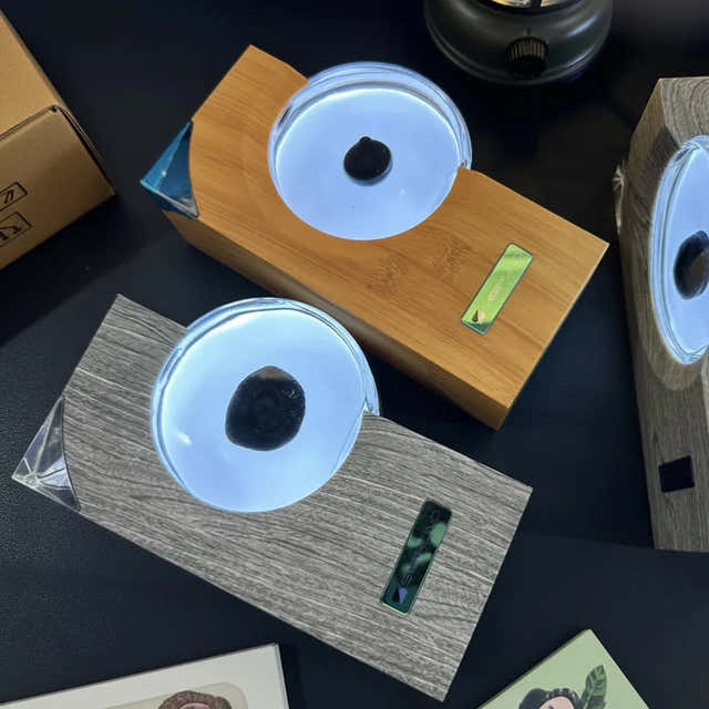 Ferrofluid rhythm lamp for a gaming desk, available in Gray and Tan wood-grain ABS finishes — Gearfinch