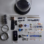 Four real IN12 tubes on a nixie tube clock kit with Pine and Walnut base options for collectors
