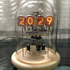 Walnut nixie tube clock kit components with infrared remote, USB-C cable, glass dome and wood base