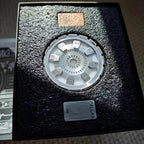 Arc reactor, two core plates, stand, and packaging shown together