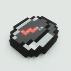 Magnetic pixel compass with red LED-lit needle in a black, grey and white 8-bit voxel frame
