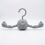 3D printed plastic Geodude clothes hanger with deep eye sockets and an angry rock monster expression