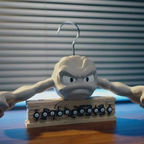Rock type anime clothes hanger with stone gray Geodude design for a fan cave wardrobe