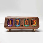 Warm amber nixie tube clock for a distinctive shelf display in a home office
