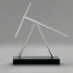 Swinging Sticks kinetic energy sculpture for a moving focal point on an executive desk