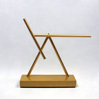 Silent electromagnetic kinetic sculpture for modern office decor and conversation-starting motion