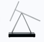 Mechanical motion sculpture for a desk or shelf, designed as an engaging focal point