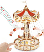 3D wooden puzzle music box with rotating swing ride chairs, warm lights and a mirrored central pillar